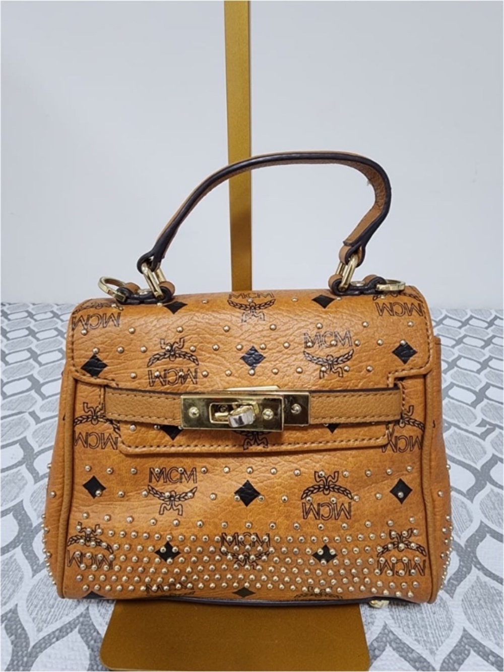 Authentic MCM Visetos Studded Coated Leather Mini Heritage Top Handle Bag Cognac